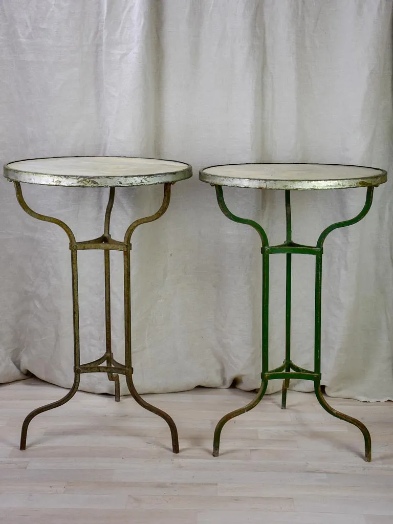 Pair of antique French marble top bistro tables